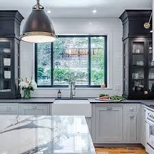 These beautiful faucets have an old charm that pairs well with farmhouse sinks, fireclay sinks, cast iron sinks, stone sinks, and undermount kitchen sinks. This Kitchen Design Is A Play On Classic Elements With Decidedly Modern Twist Trinsic Collection Featured Design And Phot Design Kitchen Design Bold Kitchen