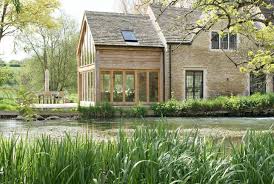 An Oak Wood And Glass Extension In Cirencester Cotswolds Old Stone Houses Cottage Extension Stone Houses
