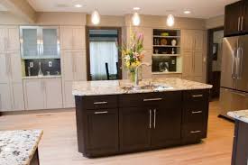 It has a sleek modern design and stainless steel countertop that is easy to clean. Kitchens Kitchens Island Granite Countertops Espresso Kitchen Cabinets Espresso Kitchen Cabinets Kitchen Cabinet Styles Shaker Style Kitchen Cabinets