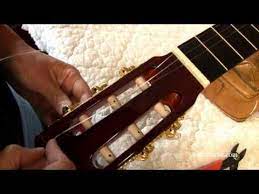 Changing Guitar Strings Video Winding Strings Around The Tuning Machine Heads Guitar Neck Guitar Strings Classical Guitar