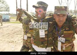Bangladesh Army soldiers practice giving medical aid to role-players during  a simulated mass casualty training