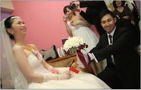 A taiwanese guy on a scooter rode by and missed the dress by an inch! Pictures Of Chinese Wedding Traditions In Taiwan