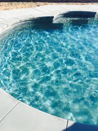 The blue grotto on the magical isle of capri creates breathtaking hues of blue light as the sun bursts through its waters. Caribbean Blue Pebble Stonescapes Pool Colors Stonescapes Pool Remodel