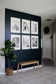 Black And White Photo Frame Ideas Dark Blue Wall With White Frames Love This Idea For A Feature Gallery Wall Decoratingideas Gallerivagg Vardagsrum Inredning