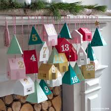 These diy advent calendars are the cutest ways to pass the days until christmas. Diy Advent Calendar Village Lia Griffith