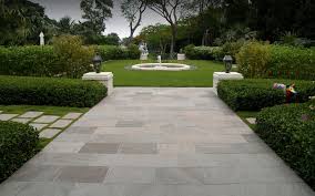 Once perimeter border is complete, wet the entire area down with a hose to allow stones and sand set. Ellegant Natural Stone Pavers For Outdoor Living Spaces