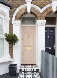 Twisty topiaries provide a dramatic entrance to the blue front door. Monthly Inspiration Our Top Pinterest Front Doors