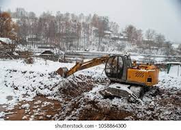 As a structure ages and seasons change, small foundation cracks are common, but when the ice and snow melts after a brutal winter like the one we just had, much larger and more dangerous settlement issues may occur, including flooding inside the building. Excavator Digging Foundation Ditch Winter Stock Photo Edit Now 1058864300