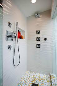 As minimalist bathroom theme, the wall is attached with white tile in two different patterns. 32 Best Shower Tile Ideas That Will Transform Your Bathroom Shower Tile White Tile Bathroom Walls Textured Tiles Bathroom