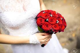 Check spelling or type a new query. Bride In White Wedding Dress Is Holding A Bouquet Of Red Roses In Hand Stock Photo Picture And Royalty Free Image Image 99277080