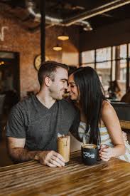 Couple In A Coffee Shop Photoshoot Coffee Shop Photography Couple Coffee Shop Coffee Engagement Photos