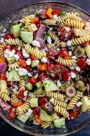 This mediterranean pasta salad has sweet heirloom cherry tomatoes, crisp cucumbers, mild red onions, salty feta crumbles, briny capers, and is tossed in the most amazing homemade red wine vinegar and herb dressing. Greek Pasta Salad Recipe Wonkywonderful