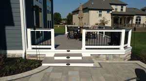 The white canvas makes the chair comfortable to sit on. How To Choose Between A Low To Grade Deck And A Patio For Your Backyard Archadeck Of Raleigh Durham