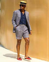 Men S Suit With Hat Navy Blue Shirt And Knee Length Shorts Perfect For The Beach Mens Suit Colors Mens Outfits Mens Shorts