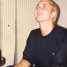 A 26-year-old Eminem photographed with the a rare Playstation 1 Debugging  Unit, 1999.