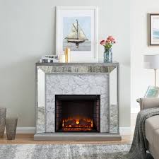 Led fire and ice electric fireplace with remote in black form and function perfectly align in this form and function perfectly align in this sleek fire and ice electric fireplace by northwest. Tynchel Mirrored Faux Marble Fireplace Antique Silver Aiden Lane Fireplace Mirror Electric Fireplace Fireplace