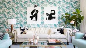 Avoid awkward open spaces on your wall by maximizing coverage of its width and height. A Guide For Knowing What To Hang Above Your Sofa And How To Execute