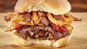 Heart Stopping Eh Canadian Eatery Chain Debuts Burger Stuffed With Reese S Candy