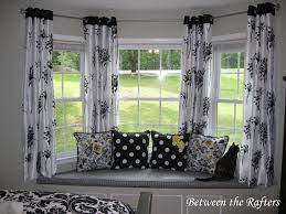 The simple yet elegant farmhouse style gives you plenty of options when it comes to window treatments — think short, casual curtains above the kitchen sink, long, romantic curtains in the dining room, and cozy, patterned curtains in the den. Between The Rafters Do It Yourself Bay Window Curtain Rod Tutorial Window Treatments Living Room Diy Bay Window Curtains Dining Room Curtains