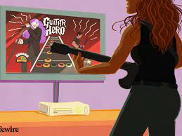 Cristen conger standing in front a television screen with your plastic axe str. Guitar Hero Iii Cheats And Unlockables For Xbox 360