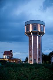 Old Water Tower Converted Into A Beautiful Modern Home Water Tower Beautiful Modern Homes Tower Design