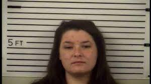 Two charged with child abuse after baby found in cage