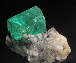 It is composed of quartzite, and the black spots are flakes of chlorite. Emerald Wikipedia