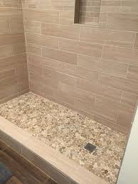 However, a linear 12 x 24 or 24 x 48 tile, such as one from the consulate line, can make any wall look like a modern design. Sliced Java Tan Pebble Tile Shower Floor 2 Bathroom Remodel Shower Pebble Tile Shower Pebble Tile Shower Floor