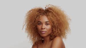 We've round up some fabulous afro hairstyles, open for you to explore. Mixed Race Black Woman With Big Curly Blond Afro Hair Poses In Studio On White Touches Her Hair Turning And Smiling Stock Video Footage Storyblocks