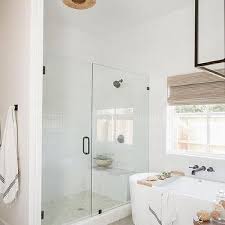 A tall, galvanized steel tub, which you can pick up at most home improvement stores for around $40 or less, doubles as a shower pan in this modestly sized bathroom designed by tiny heirloom. Tub Next To Shower Design Ideas