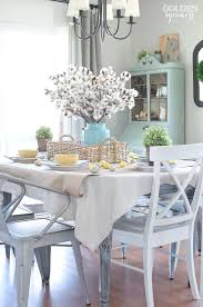 Curved flower glass centerpiece on a cherrywood dining table. Minimal Dining Table Decor Novocom Top