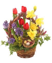 Premium basket flower arrangement is one of such gifts that is bound to take the recipient's breath away. It S Finally Spring Basket Arrangement Spring Flowers Flower Shop Network