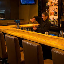 Bar top onyx and wall panels. Backlit Honey Onyx Bar