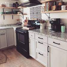 Stunning kitchen features light gray cabinets paint ed sherwin williams gray screen accented with gold hardware paired with white quartz countertops and a white subway tiled backsplash accented with dark grout. Agreeable Gray Sw 7029 Is It Truly The Best Gray West Magnolia Charm