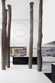 Tree Trunks Through Store Shop Interior Exterior Design Shop Verkaufsraum Und Architektur Innenarchitektur