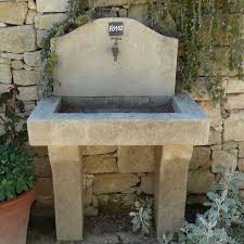 sink carved in natural stone by the