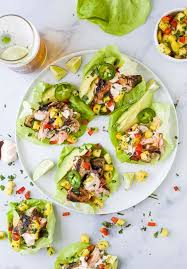 While the salmon is baking, chop the veggies and heat tortillas in a skillet. Southwestern Grilled Salmon Tacos With Pineapple Salsa