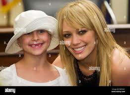 Actress Hilary Duff smiles as she meets children during a visit to Capitol  Hill to promote National Military Families Week June 10, 2005 in  Washington. (UPI Photo/Kamenko Pajic Stock Photo