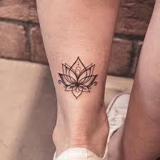 Small Tattoo On The Calf Floral Tattoo Lotus Female Leg Tattoos Female Floral Lotus Small Ta Wrist Tattoos For Women Leg Tattoos Women Sunflower Tattoos