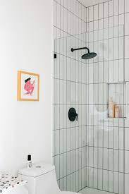 Vertical Stacked Tile Shower In 2021 Black Shower Fixtures Bathroom Inspiration Home Staging
