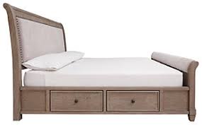 Discount bed sets in a range of variations and sizes: Challene Queen Upholstered Bed With 4 Storage Drawers Ashley Furniture Homestore