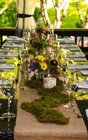 Burlap Moss Table Runner With Wild Flowers And Birch Log Candle Holders Www Marvelleevents Ca Harvest Table Decor Moss Table Runner Birch Log Candle Holder