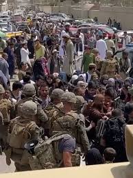 Soldiers and marines assist with security at an evacuation control checkpoint during an evacuation at hamid karzai international airport, kabul, afghanistan, aug. 79 Ruxhsj 5zjm
