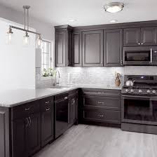 The entirely gray kitchen might sound boring, but actually, it could be unique than others if you play with materials correctly to create a difference in your kitchen! Kitchen Remodel With Storm Finish Viking Kitchen Cabinets