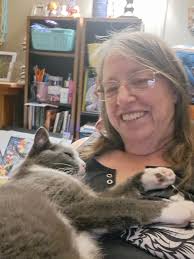 Hello, I'm new here and thought I'd share a photo of my cat, Pretty Girl.  She's always up for some