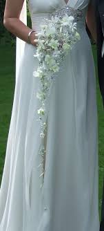 Beautiful Ornate Cascade Trailing Wedding Bouquet Of White Dendrobium Orchids With Crystal An Cascading Wedding Bouquets Flower Bouquet Wedding Bride Bouquets