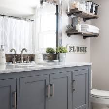 The shade of color in the vanity is replicated on the stone surrounding the tub. 17 Classic Gray And White Bathrooms