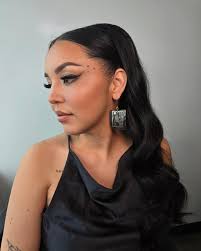 A photo of @lorelei.williams wearing the mmiw2s cape that I made for her  with custom face paint for a previous shoot ❤️ #mmiwg2s #custommade  #fashionwithpurpose