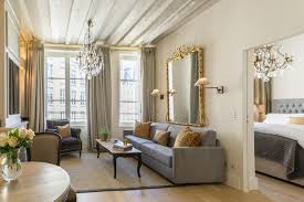 Inside the apartment there is a dishwasher and microwave in the kitchen and a wall unit air conditioner in the living room. Place Dauphine One Bedroom Apartment Rental Paris Parisian Apartment Decor One Bedroom Apartment Apartment Decorating Rental