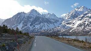 The municipality is characterized by the towering, alpine mountains that rise 1833 metres right up from the arctic ocean. Lyngen Wikipedia